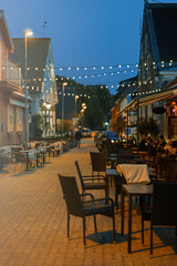 Fototapeta na wymiar Night street with restaurants in Pärnu city in summer.