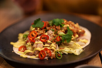 Traditional tacos with meat in a restaurant.
