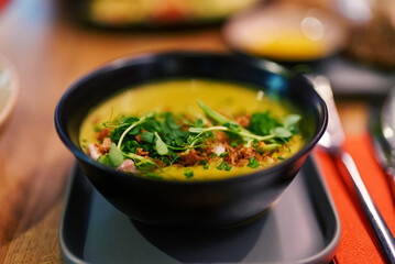Diet pumpkin soup in a restaurant.