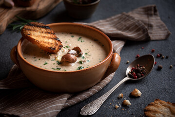 Creamy porcini mushroom soup in a rustic bowl