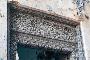The top of antique Indian style Wooden Door in Stone Town, Zanzibar, Tanzania - obrazy, fototapety, plakaty