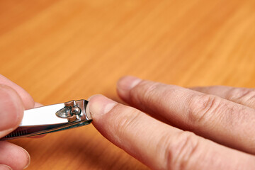 Nippers bite off nails. Hand nail care.