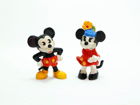 Mickey Mouse and Minnie retro toys figures. Plastic doll. Vintage. Isolated. Cartoon character from Walt Disney Pictures Studios. Mickey is Minnie Mouse's boyfriend. Classic Mickey.