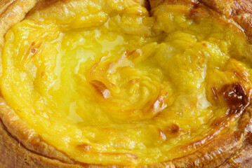 Macro. Sweet and traditional ensaimada covered with burnt cream.