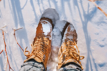 Yellow shoes in the snow in winter