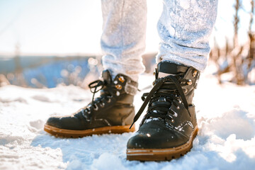 Black men's shoes in the snow