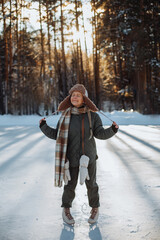 Smiling young girl on ice rink