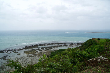 Fototapeta na wymiar The view of Chinen cape with ocean on bad wether day.