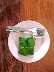 Thai food. Sticky rice wrapped in banana leaves