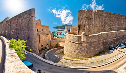 Dubrovnik city walls and harbor view, UNESCO world heritage site - obrazy, fototapety, plakaty