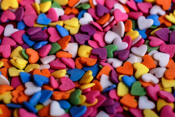 Fototapeta na wymiar Colored heart candies close-up for background