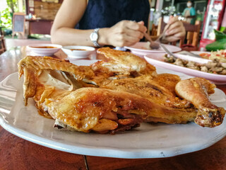 Grilled chicken Thai style served in a restaurant.