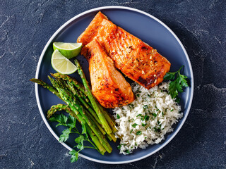 fried salmon fish fillet with rice and asparagus