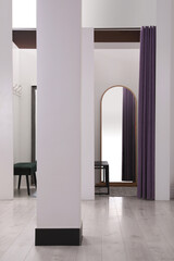 Empty dressing rooms in fashion store. Stylish interior