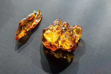 Jewelry made of amber. Natural amber on the table.