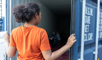 Woman trapped in cargo container wait for Human Trafficking or foreigh workers, Woman holding...