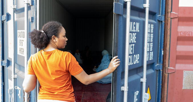 Woman trapped in cargo container wait for Human Trafficking or foreigh workers, Woman holding master key wait for holp help	