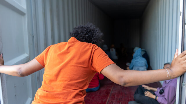 Woman trapped in cargo container wait for Human Trafficking or foreigh workers, Woman holding master key wait for holp help	