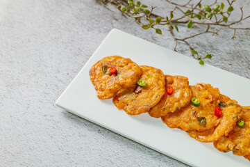 kimchijeon, Korean food kimchi pancake : Slices of well-fermented kimchi mixed into a flour batter and pan- fried. Finely chopped pork, squid, and clam meat may be added to the batter as well.