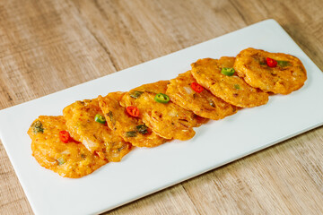 kimchijeon, Korean food kimchi pancake : Slices of well-fermented kimchi mixed into a flour batter and pan- fried. Finely chopped pork, squid, and clam meat may be added to the batter as well.