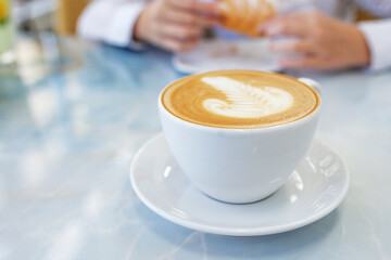 A cup of coffee at the cafe. Silence and harmony in the big city. Lifestyle