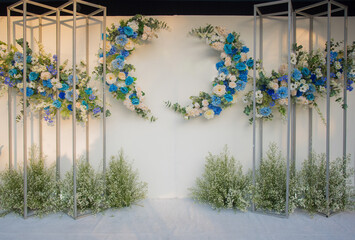 Wedding backdrop flowers in white, green, blue, blue, purple tones