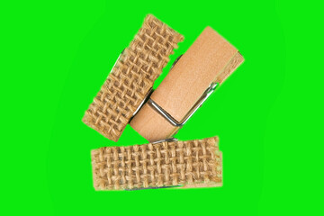 Three small clothespins in green background