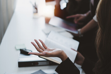 Business people meeting and analyst financial advisor preparing statistical report searching documents on work desk, browsing information online by digital tablet.