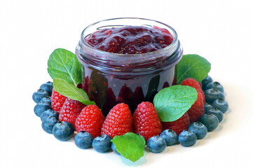 jam made from ripe juicy raspberries, strawberries, blueberries photographed close-up. isolated photo