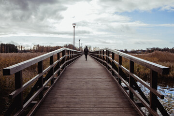 Fototapeta premium The longest wooden pedestrian bridge across Sirvena lake in Birzai, Lithuania