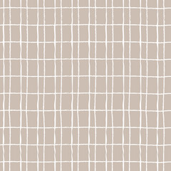 Seamless checkered repeating pattern with hand drawn grid. beige plaid background for wrapping paper, surface design and other design projects