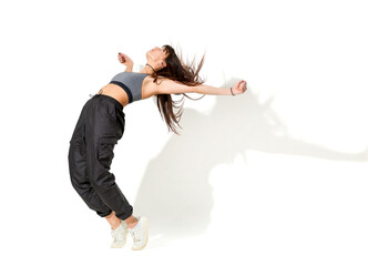 Flexible woman dancing hip hop in studio