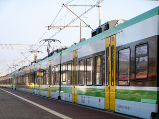 Plakat A new electric train at the station