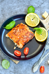 Fish bake preparated in Ticino style with sweet gorgonzola cheese and tomato crust
