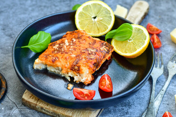 Fish bake preparated in Ticino style with sweet gorgonzola cheese and tomato crust