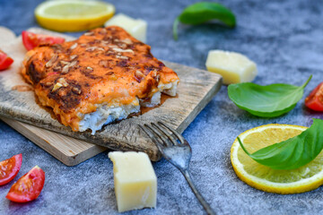  Fish bake preparated in Ticino style  with sweet gorgonzola  cheese and tomato crust