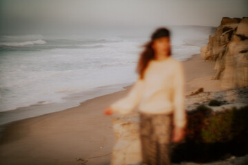 Fototapeta na wymiar woman on the beach at the sunset 