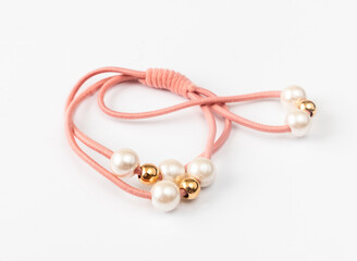 Hair band with pearls on a light background