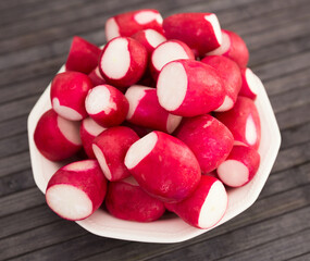 cooked crispy radish in white bowl on wooden table