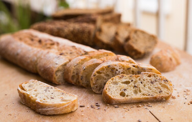 fresh loaf of bread on wooden board