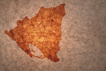 map of nicaragua on a old vintage crack paper background