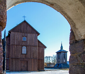 An 8th-century historic wooden Roman Catholic church complex consisting of a belfry and the church of St. Barbara in the village of Kramarzewo in Podlasie, Poland.