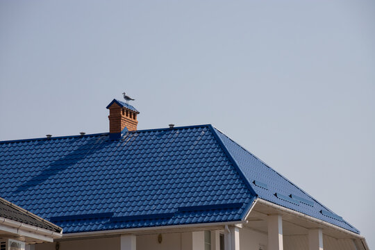 detail of roof of the house against blue sky