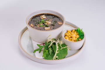 Miso soup with Kombu and Hiashi seaweed, with Tofu cheese and herbs
