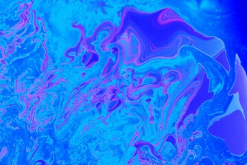 Abstract blue marble background. Acrylic texture with marble pattern. Mixing colors creates an interesting structure. It is well suited for laptop background and wallpaper, fabric
