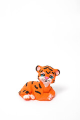 little tiger cub made of chocolate on white background