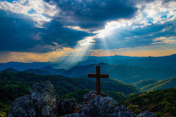 Symbol of God love to people the mountain at sunset