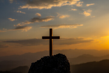 Symbol of God love to people the mountain at sunset