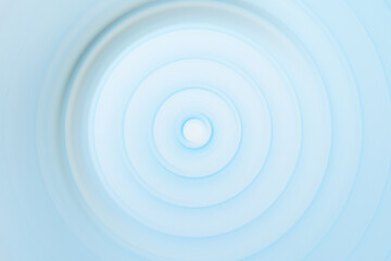 Circular rippled light blue water surface