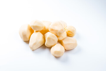 Raw peeled potatoes on a white background. Ofoschi